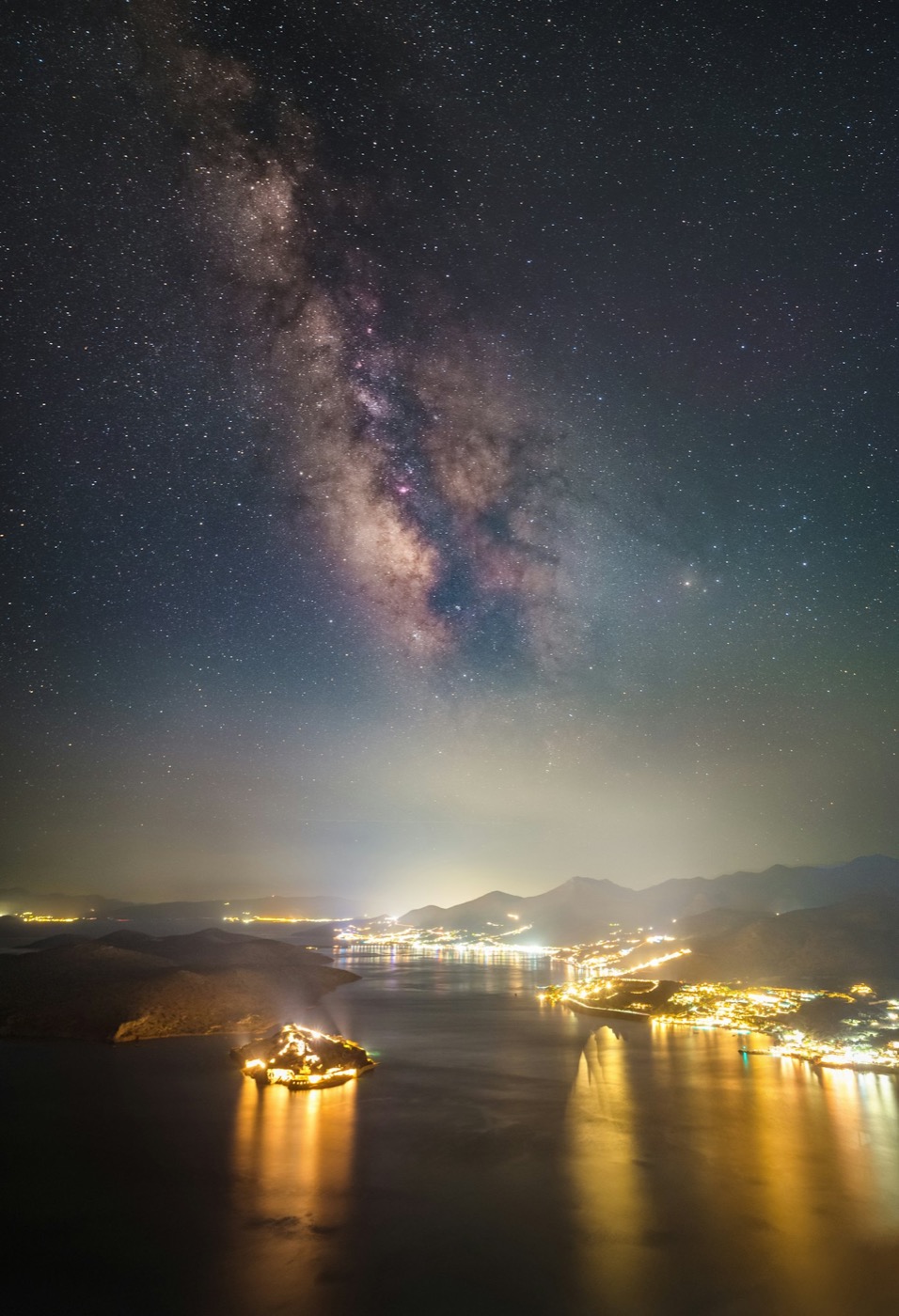 The Milky Way over the coastline at night